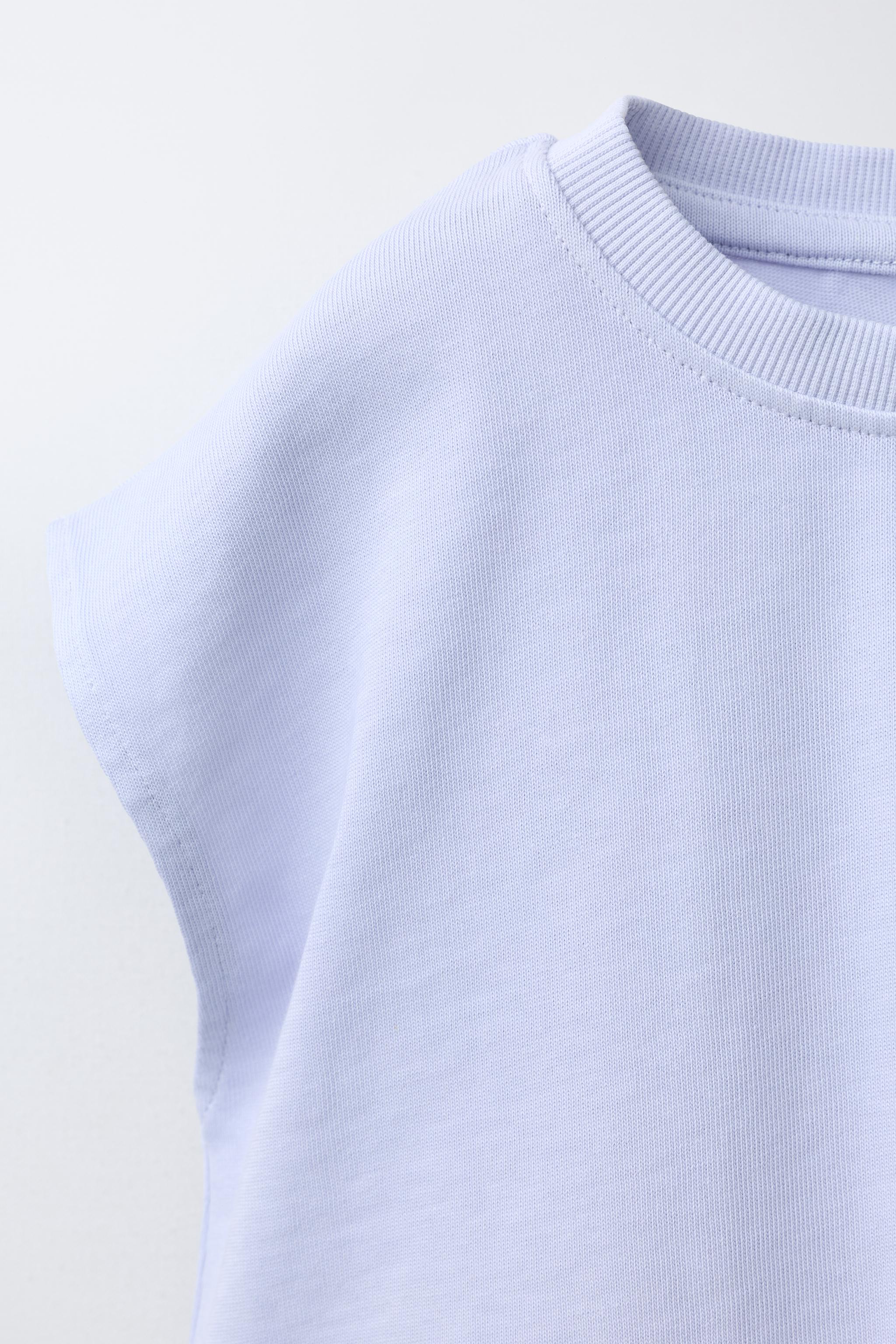 T-SHIRT UNI À ÉTIQUETTE